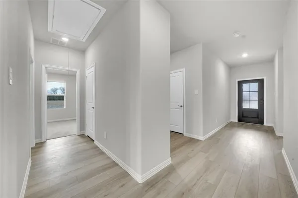 a view of hallway with wooden floor