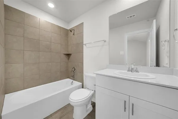 a bathroom with a sink a toilet and bathtub