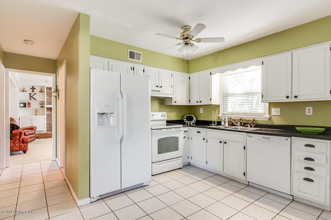 806 Moser Road Louisville, KY 40223 - Photo 12 of 34 crisp kitchen with great workspace and view of the backyard action.