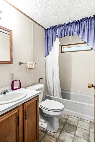 a view of roof deck with patio