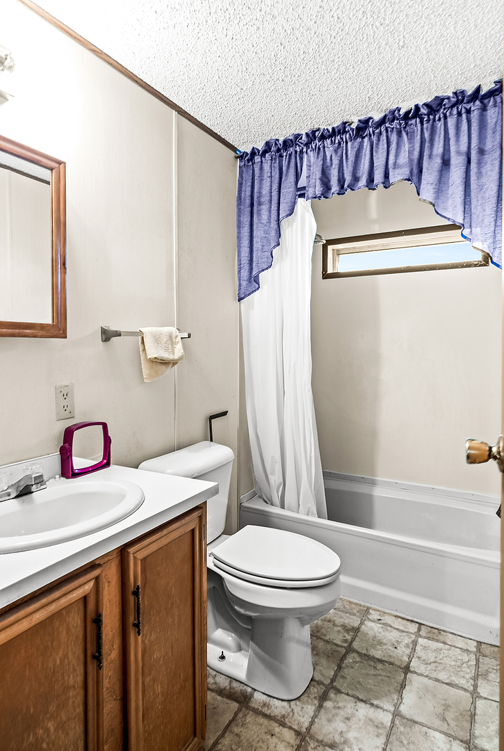 1 Christine Way Bloomington, IL 61701 - Photo 14 of 17 a bathroom with a sink toilet and shower