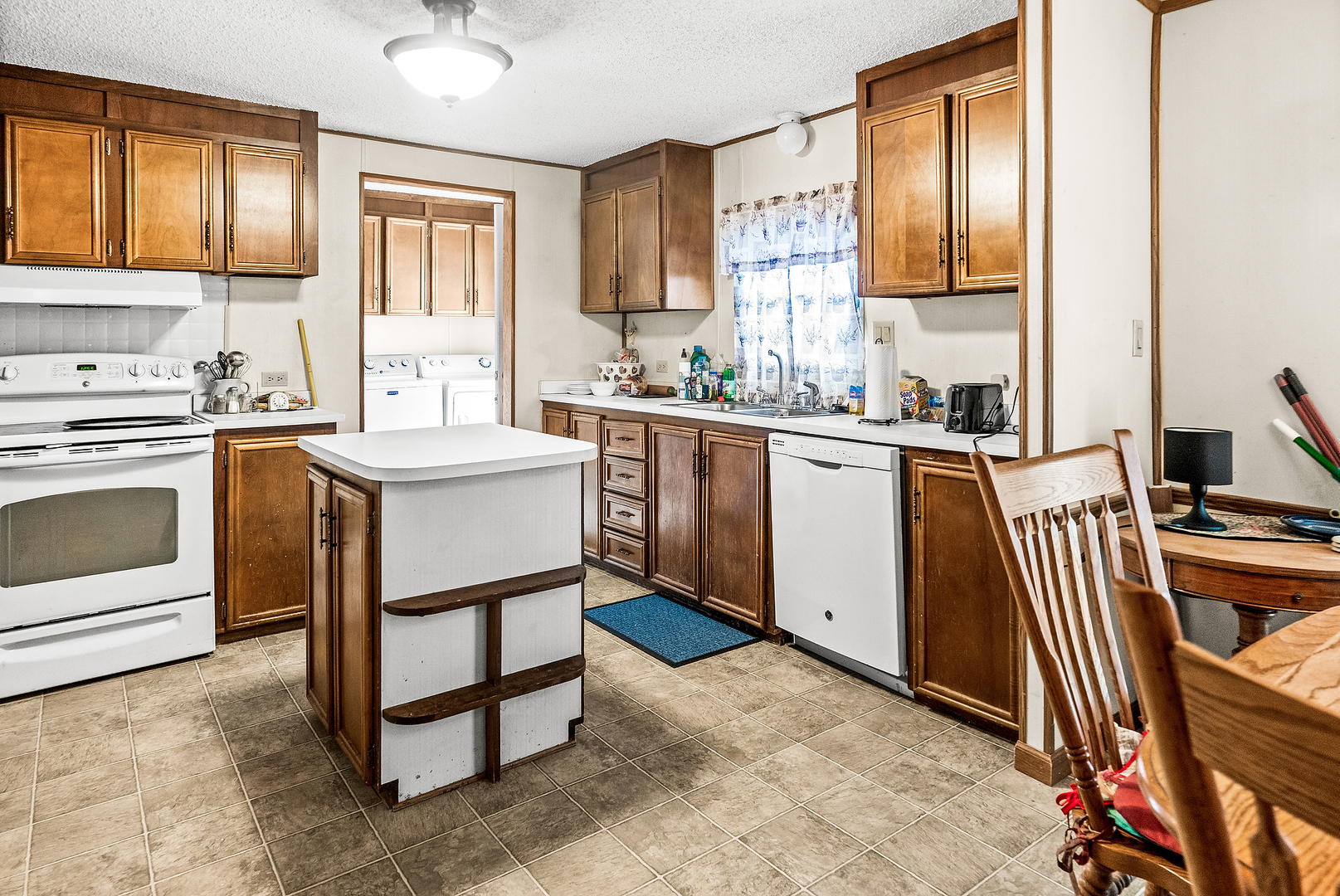 1 Christine Way Bloomington, IL 61701 - Photo 3 of 17 a kitchen with stainless steel appliances granite countertop a stove a sink and a refrigerator