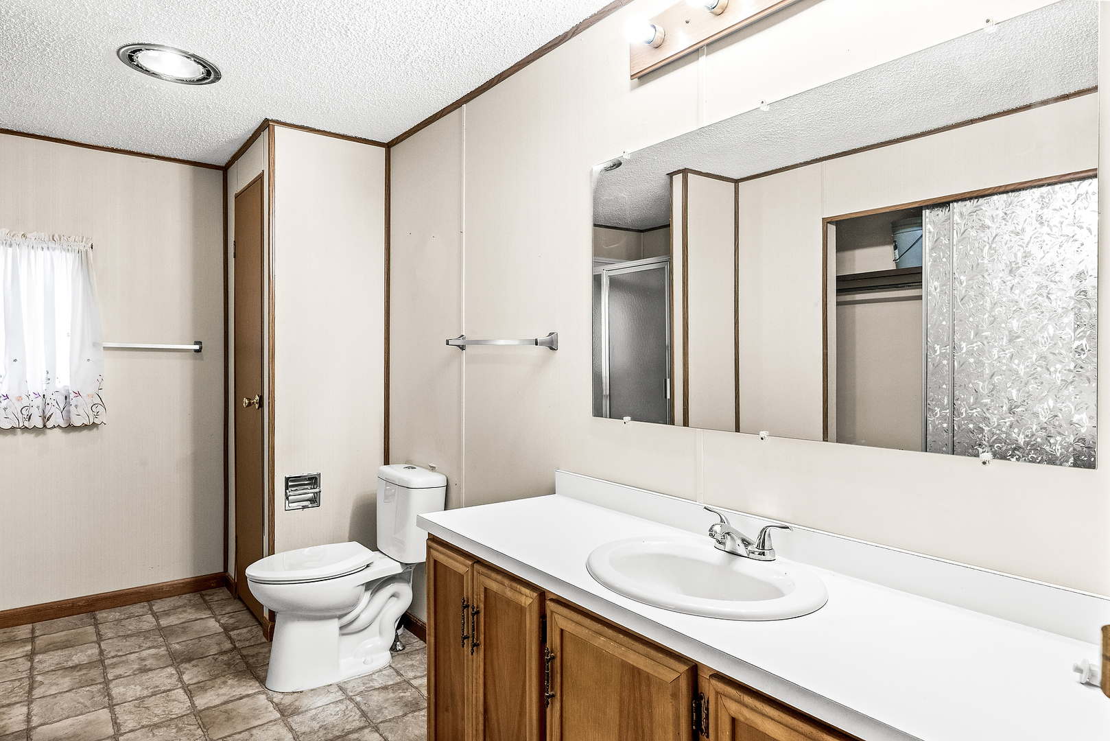 1 Christine Way Bloomington, IL 61701 - Photo 10 of 17 a bathroom with a sink toilet and shower