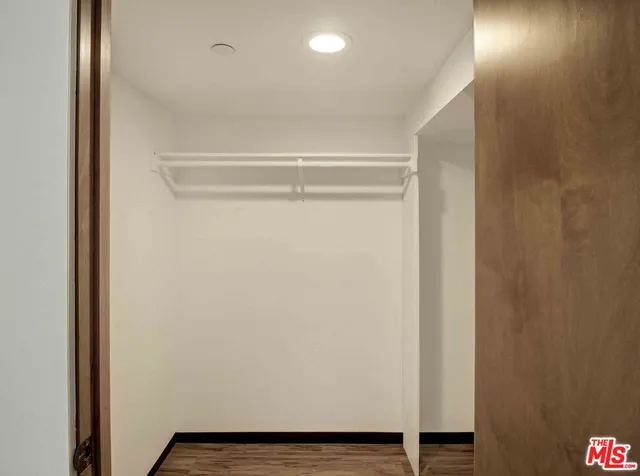 a view of room with wooden floor