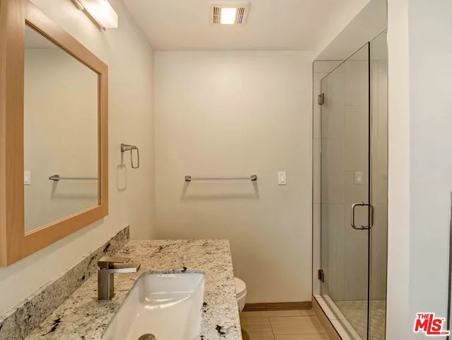 a bathroom with a sink and a shower