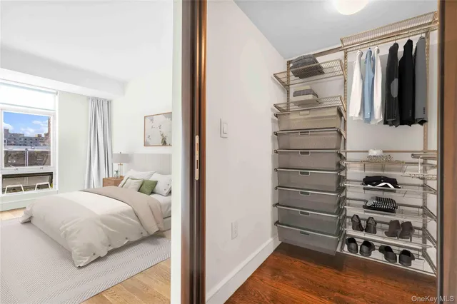 a bedroom with a bed and a walk in closet