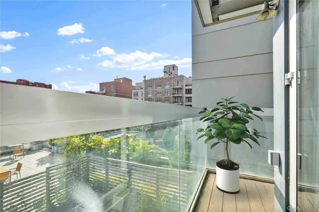 a view of balcony with a potted plant