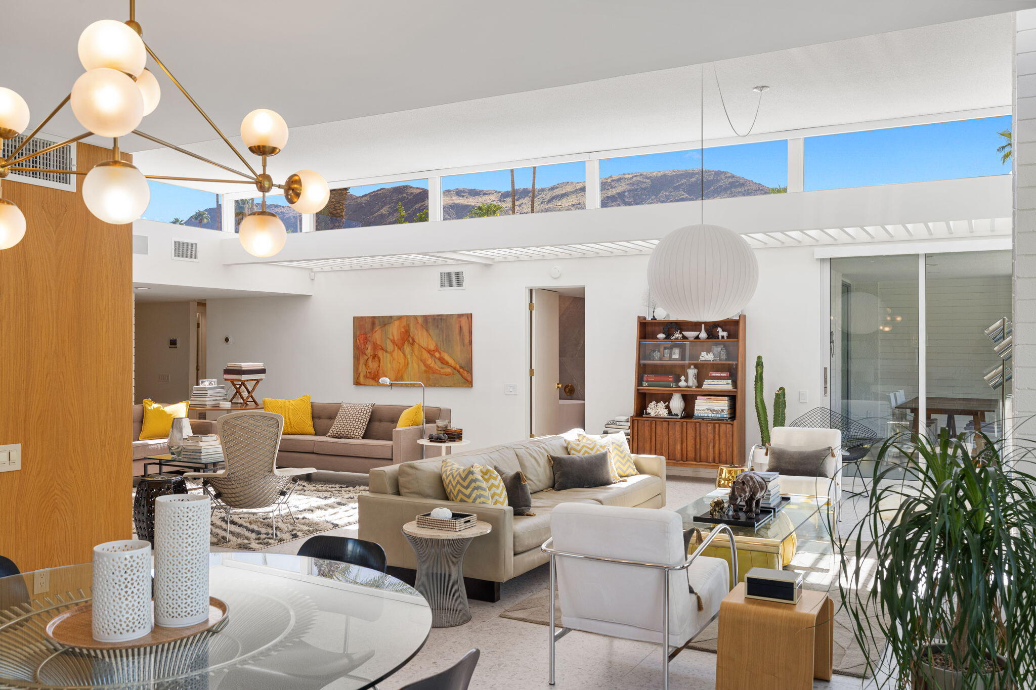 2691 Kings Road East Palm Springs, CA 92264 - Photo 11 of 45 a living room with furniture and a chandelier