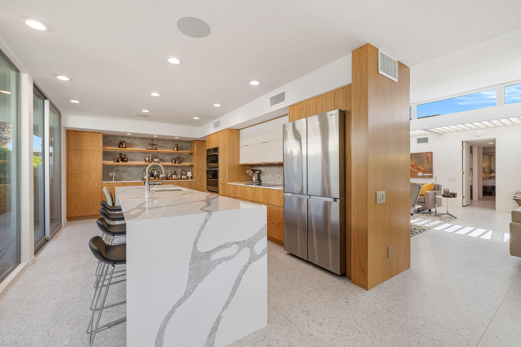 2691 Kings Road East Palm Springs, CA 92264 - Photo 13 of 45 a kitchen with stainless steel appliances kitchen island granite countertop a refrigerator and a stove