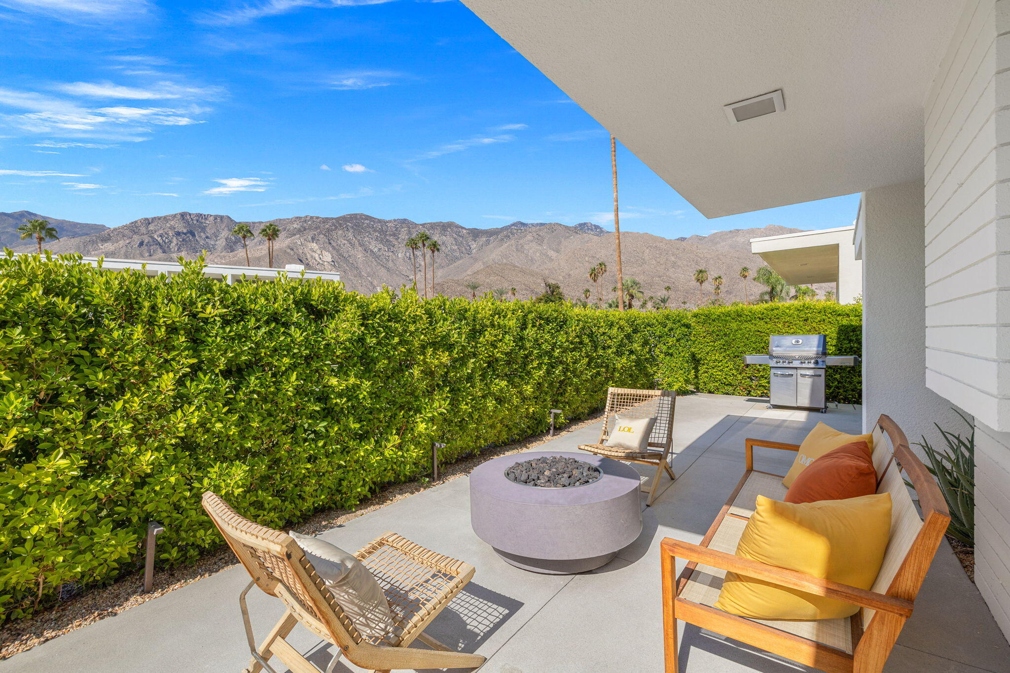 2691 Kings Road East Palm Springs, CA 92264 - Photo 32 of 45 a view of a patio with furniture and a garden