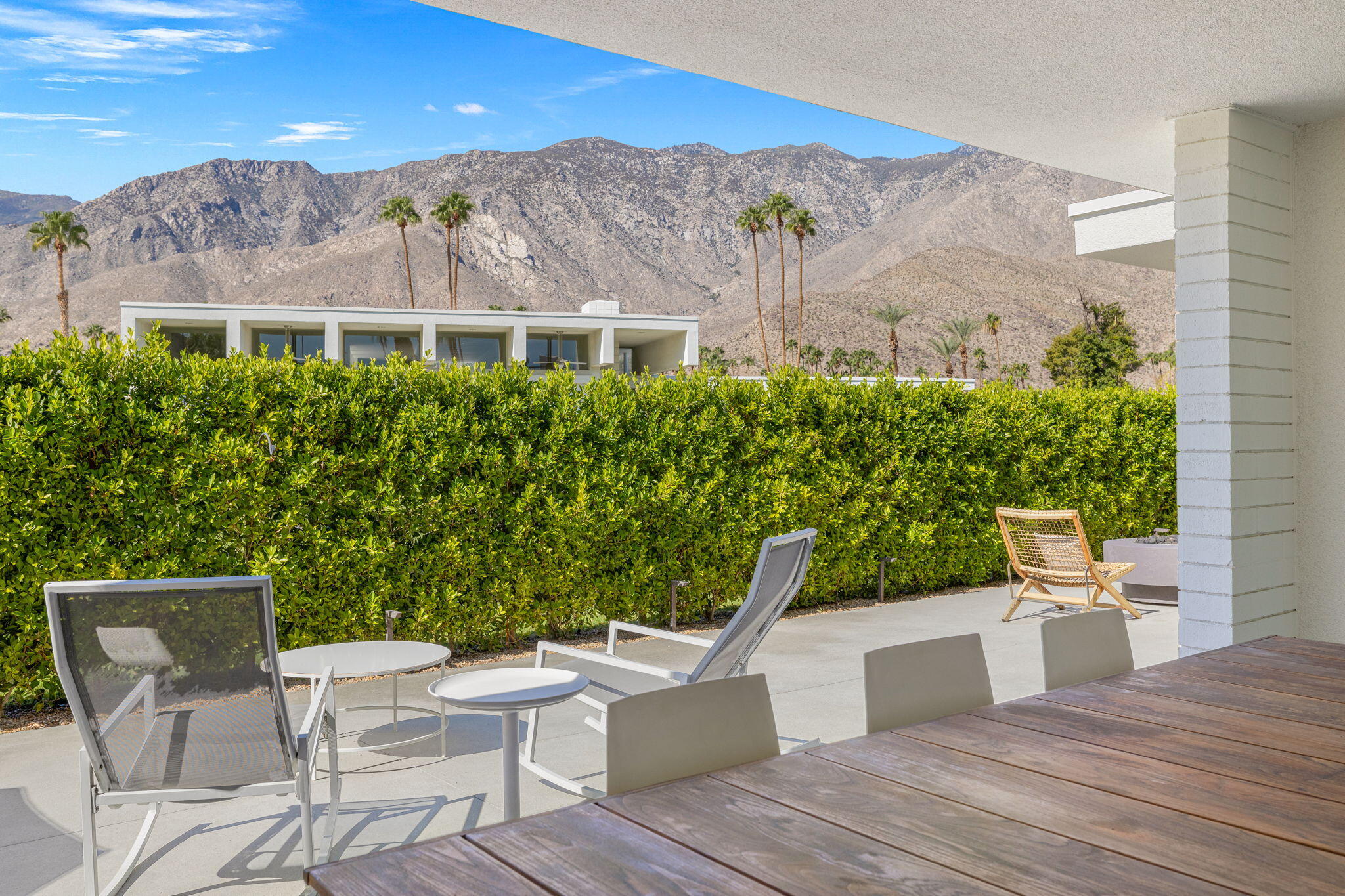 2691 Kings Road East Palm Springs, CA 92264 - Photo 36 of 45 a view of a patio with couches table and chairs