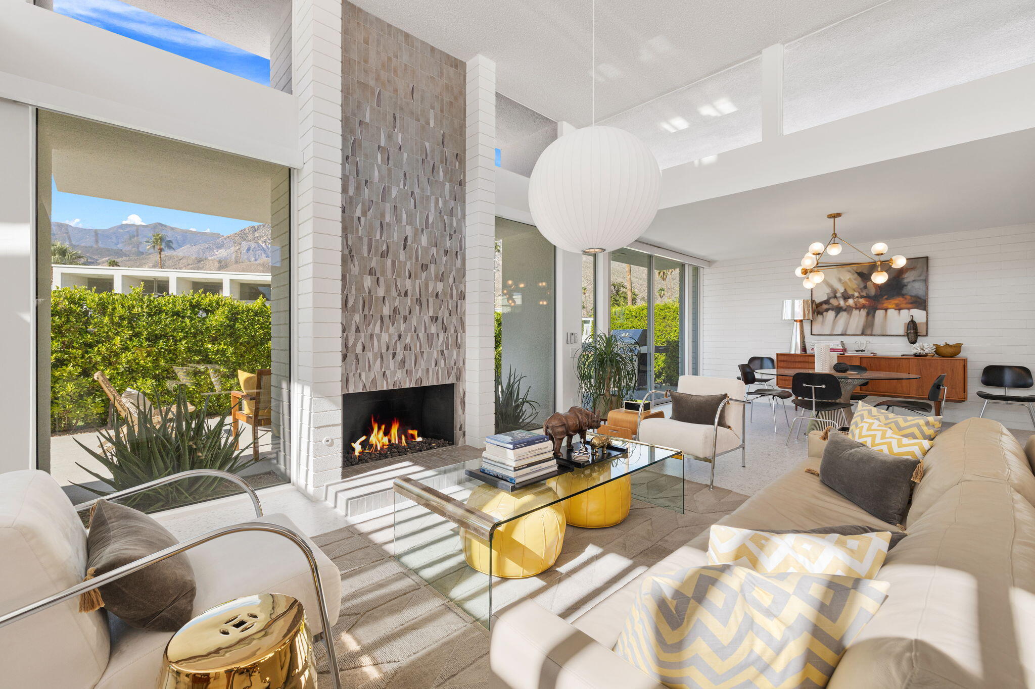 2691 Kings Road East Palm Springs, CA 92264 - Photo 6 of 45 a living room with furniture large window and fireplace