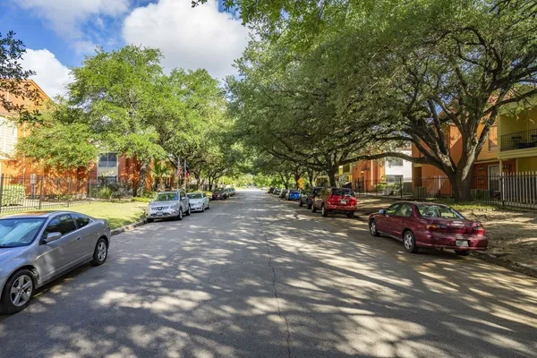a view of a street with cars