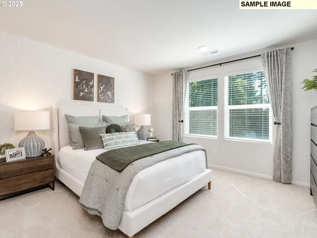 a bed room with a bed and a large window