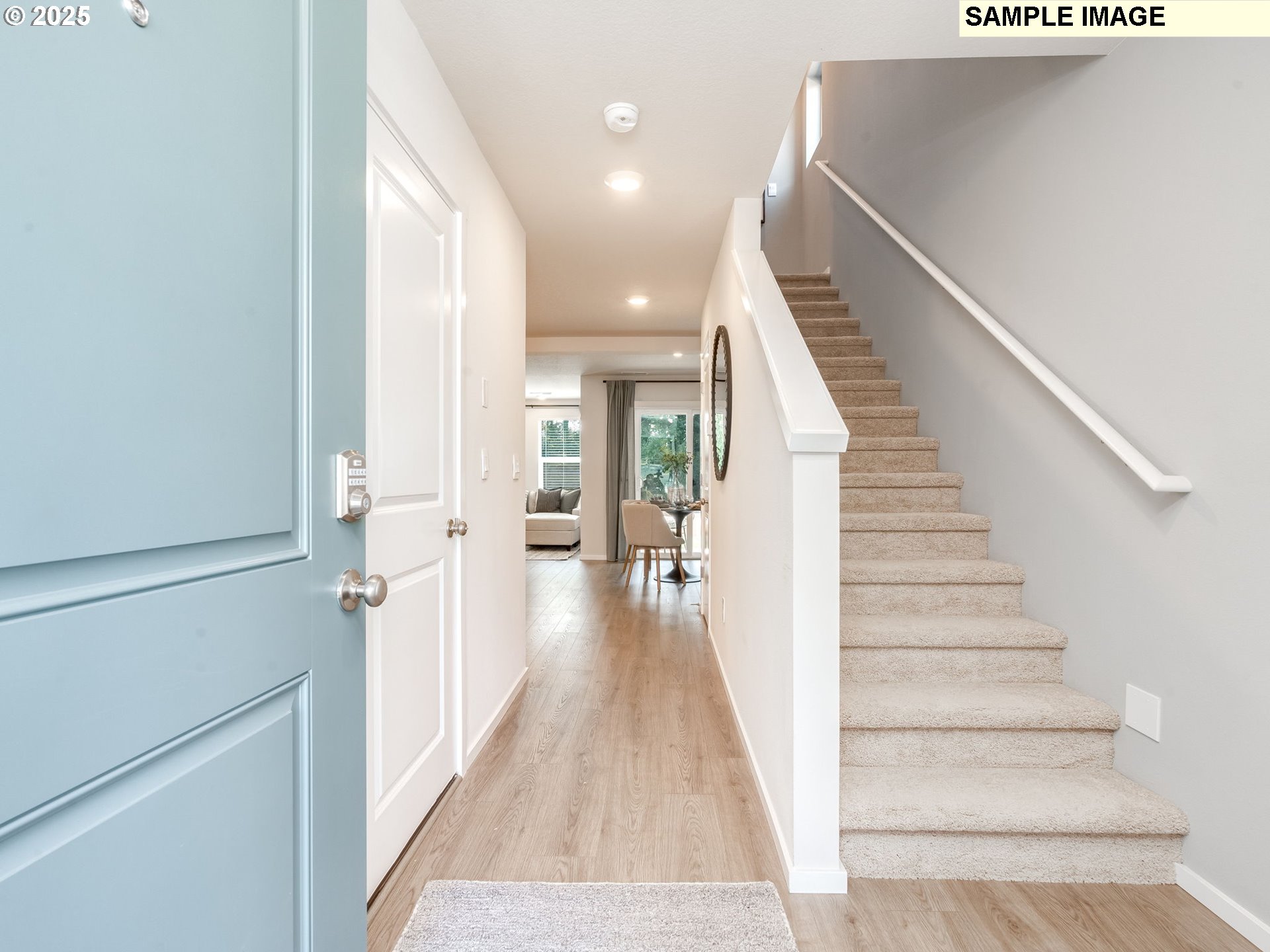 11116 Southeast Maxon Road Vancouver, WA 98664 - Photo 2 of 30 a view of a hallway with wooden floor and staircase