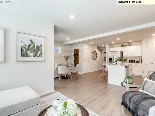 a living room with furniture and a dining table with wooden floor