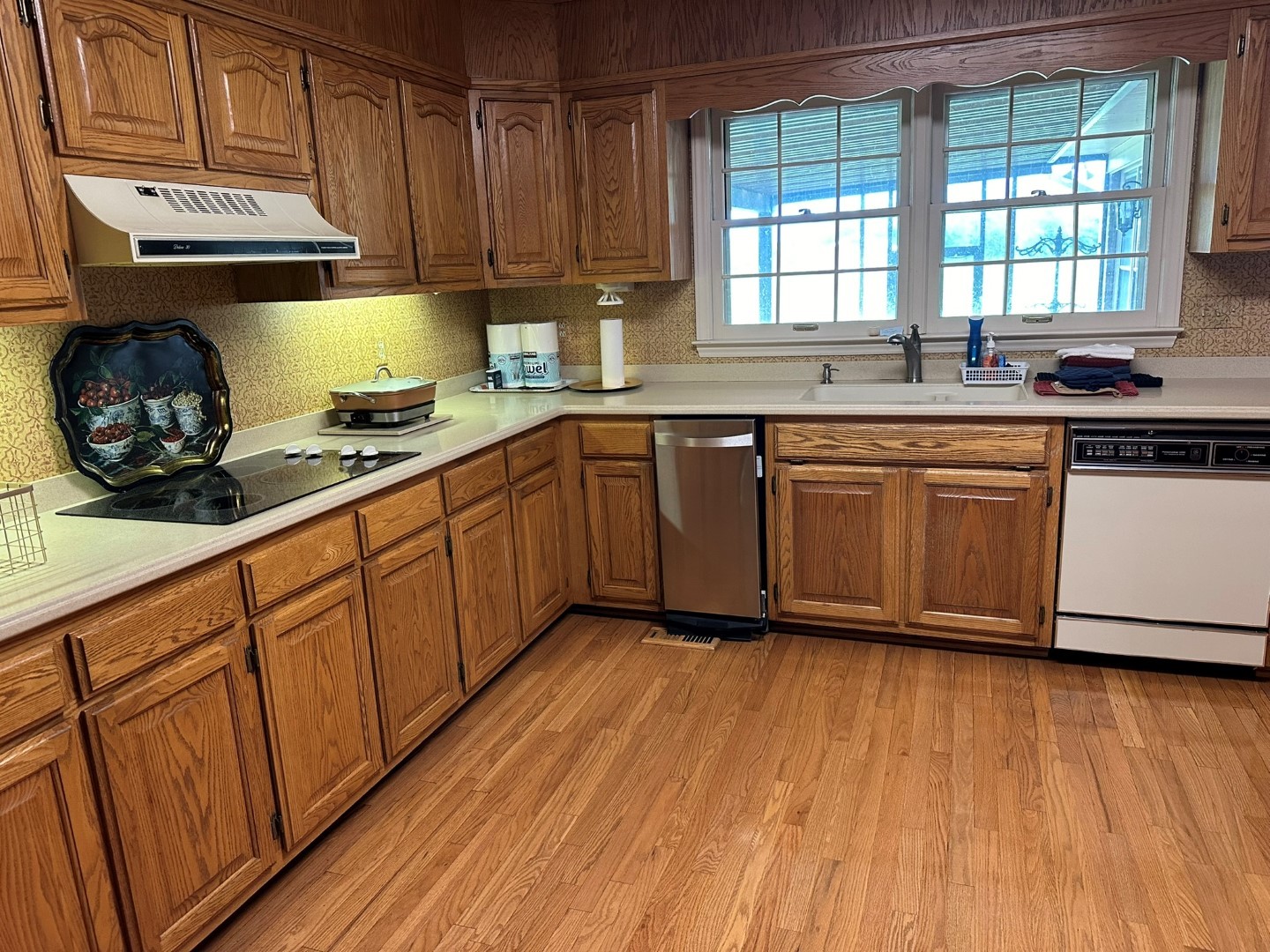 9081 Concord Road Rockvale, TN 37153 - Photo 18 of 68 a kitchen with stainless steel appliances granite countertop wooden floors a stove and a sink