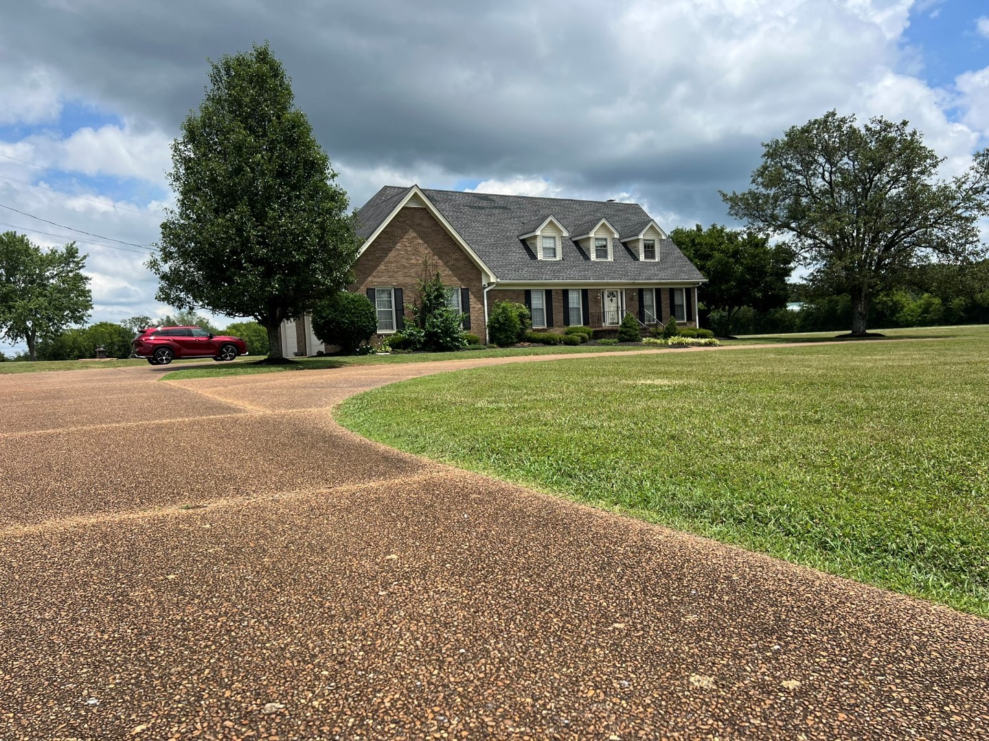 9081 Concord Road Rockvale, TN 37153 - Photo 44 of 68 a front view of a house with a yard and garage