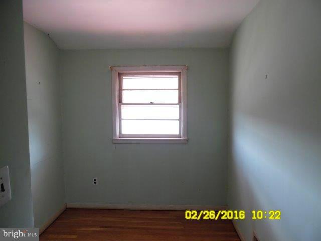 837 Lannerton Road Baltimore, MD 21220 - Photo 12 of 14 a view of an empty room with wooden floor and a window