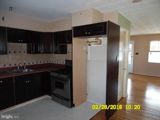 837 Lannerton Road Baltimore, MD 21220 - Photo 7 of 14 a kitchen with stainless steel appliances granite countertop a refrigerator and a stove top oven