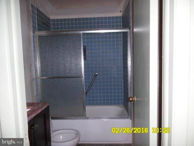 837 Lannerton Road Baltimore, MD 21220 - Photo 10 of 14 a bathroom with a shower and a toilet