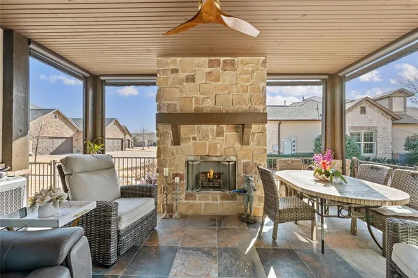 a building outdoor space with patio furniture and potted plants