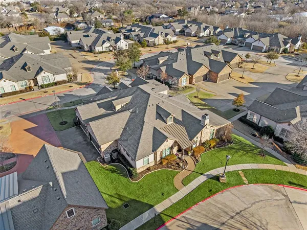 an aerial view of a house with a swimming pool