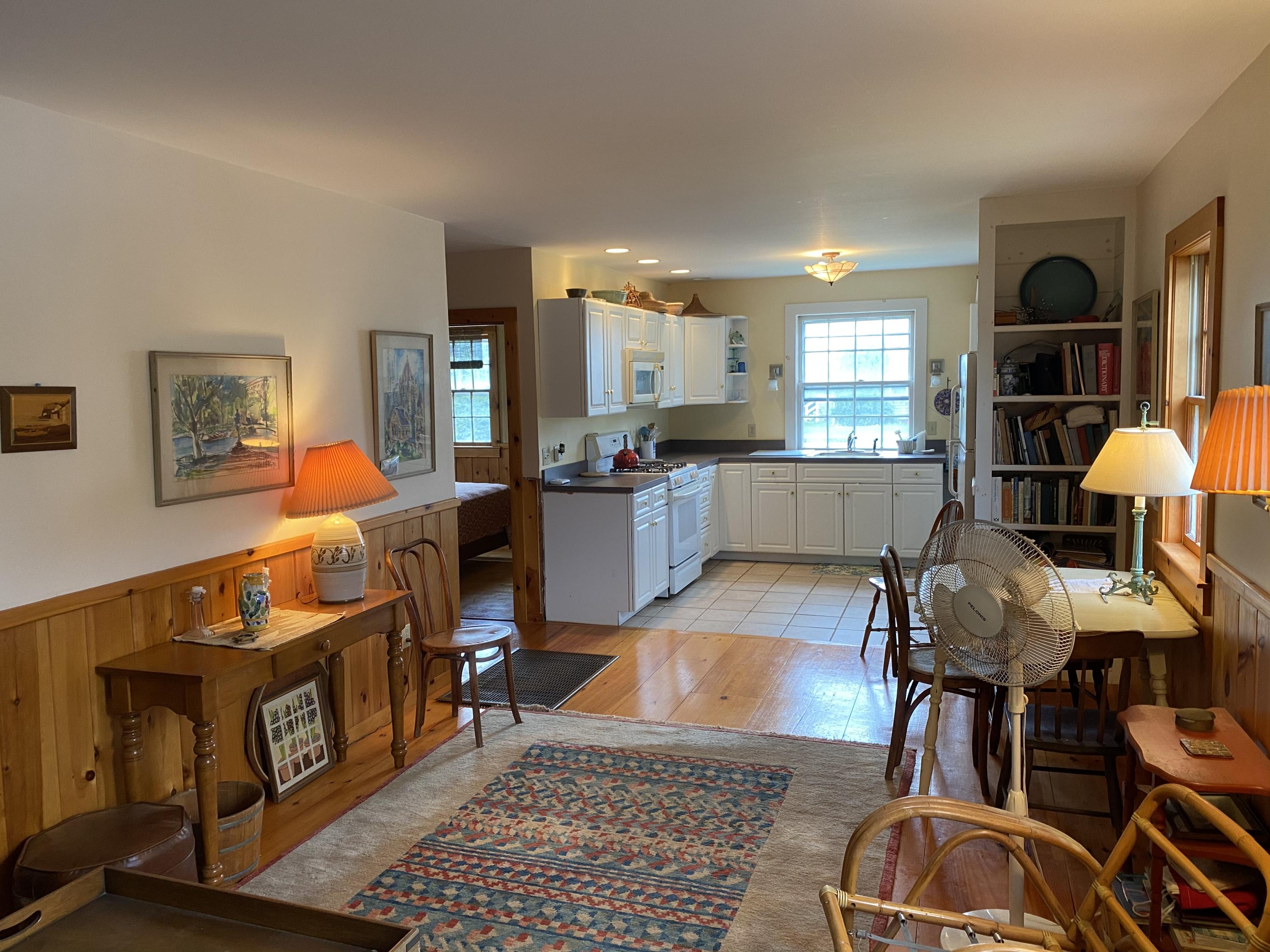146 Mashnee Road Bourne, MA 02532 - Photo 4 of 32 a living room with furniture and a wooden floor