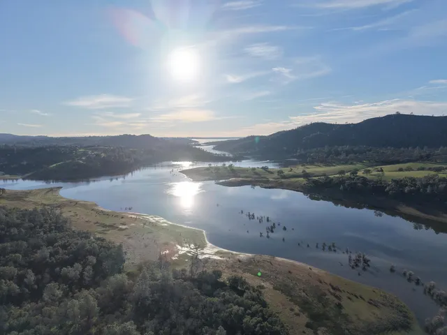 a view of a lake with mountains in the background
