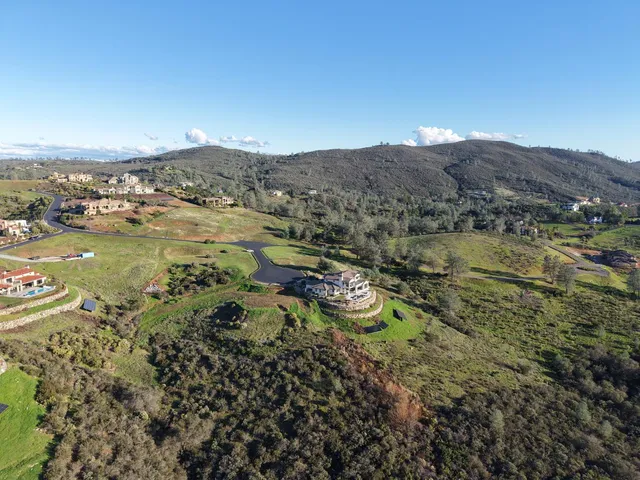a view of a city with mountains in the background