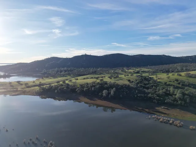 a view of a lake with mountains in the background