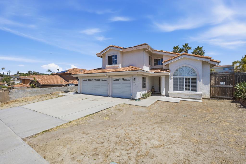 2077 Westwood Road Vista, CA 92083 - Photo 3 of 37 front view of a house with a yard
