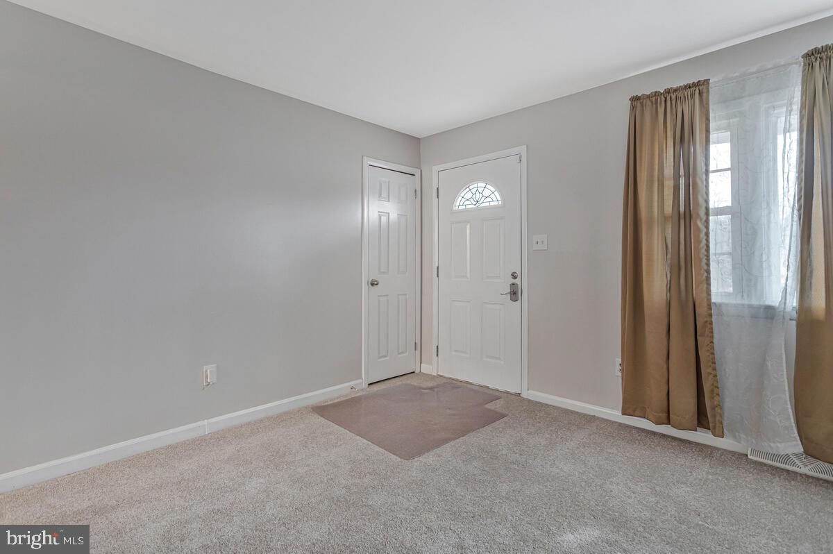 6015 Cracklingtown Road Hughesville, MD 20637 - Photo 12 of 17 a view of an empty room with window and closet area