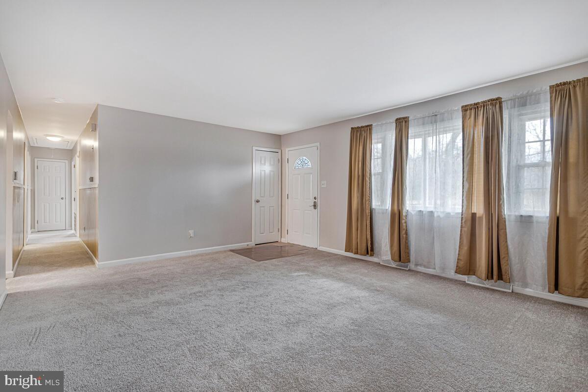 6015 Cracklingtown Road Hughesville, MD 20637 - Photo 10 of 17 a view of empty room with windows and closet