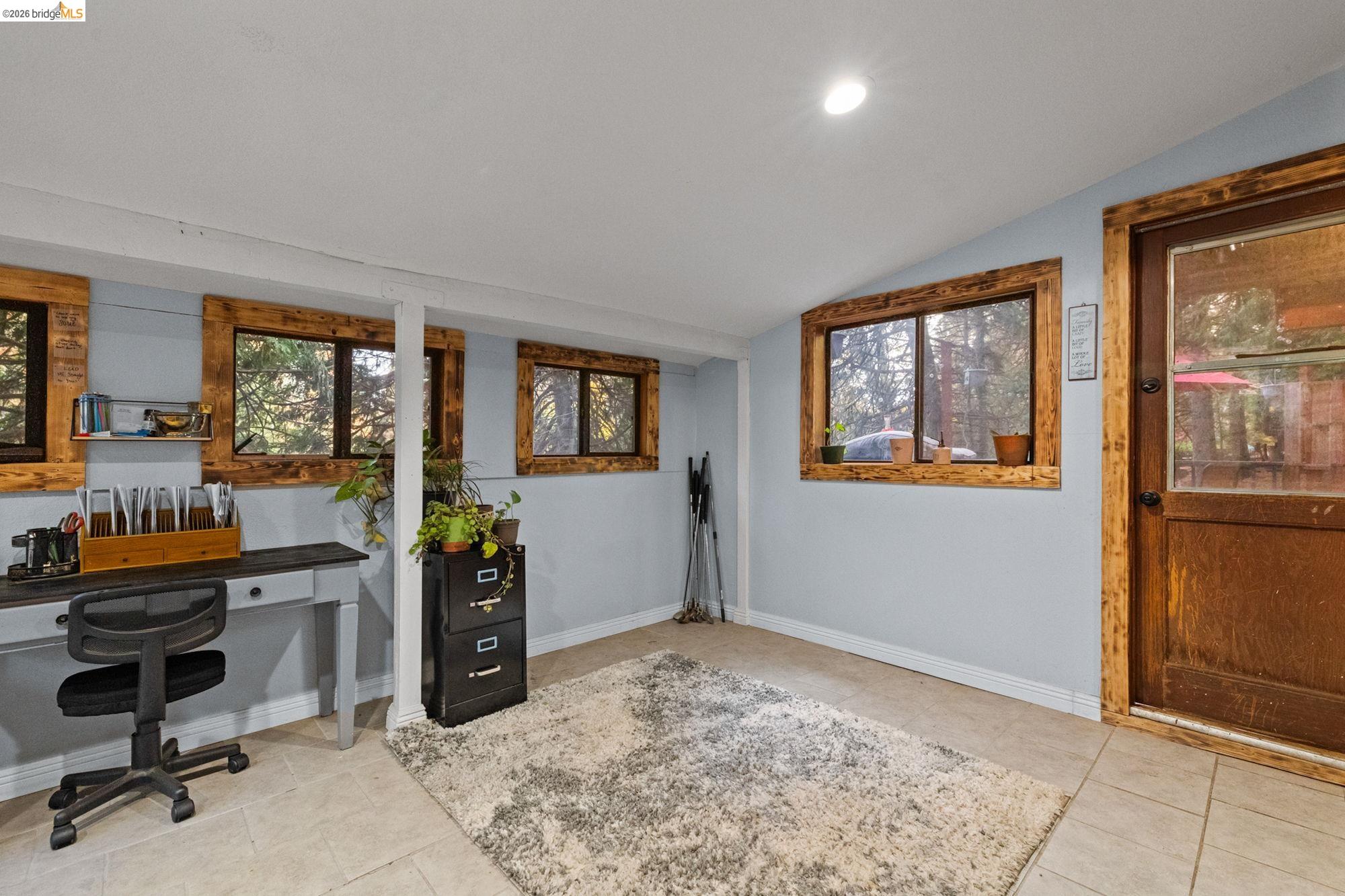 17851 Robin Road Twain Harte, CA 95383 - Photo 13 of 45 Home office featuring vaulted ceiling, recessed lighting, and light tile patterned flooring