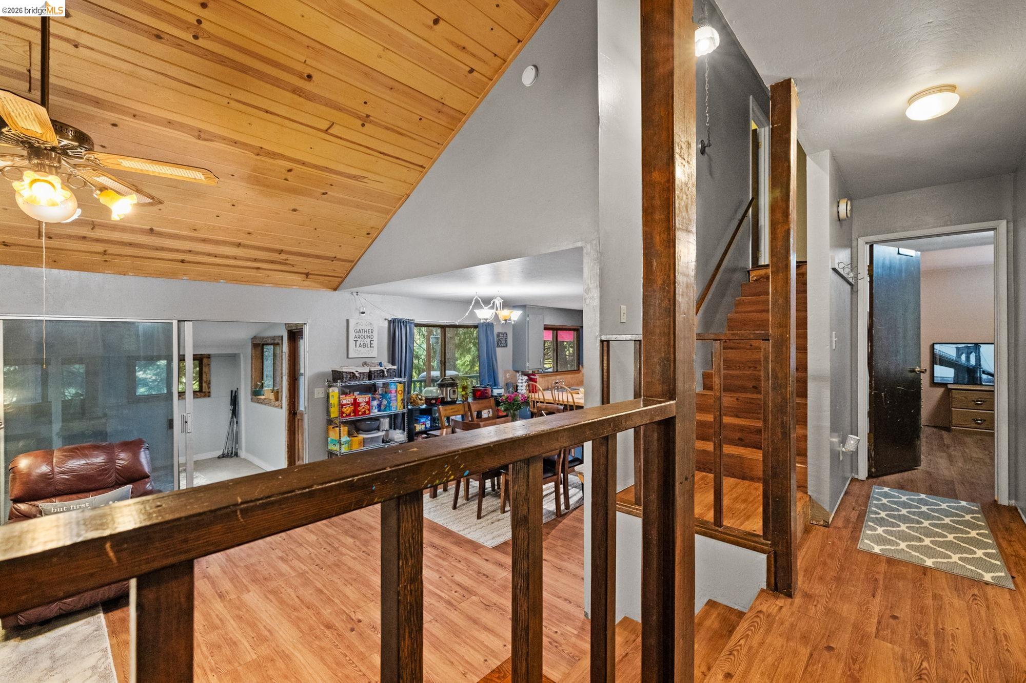 17851 Robin Road Twain Harte, CA 95383 - Photo 15 of 45 Corridor featuring a vaulted wood ceiling, light wood-type flooring, and a chandelier