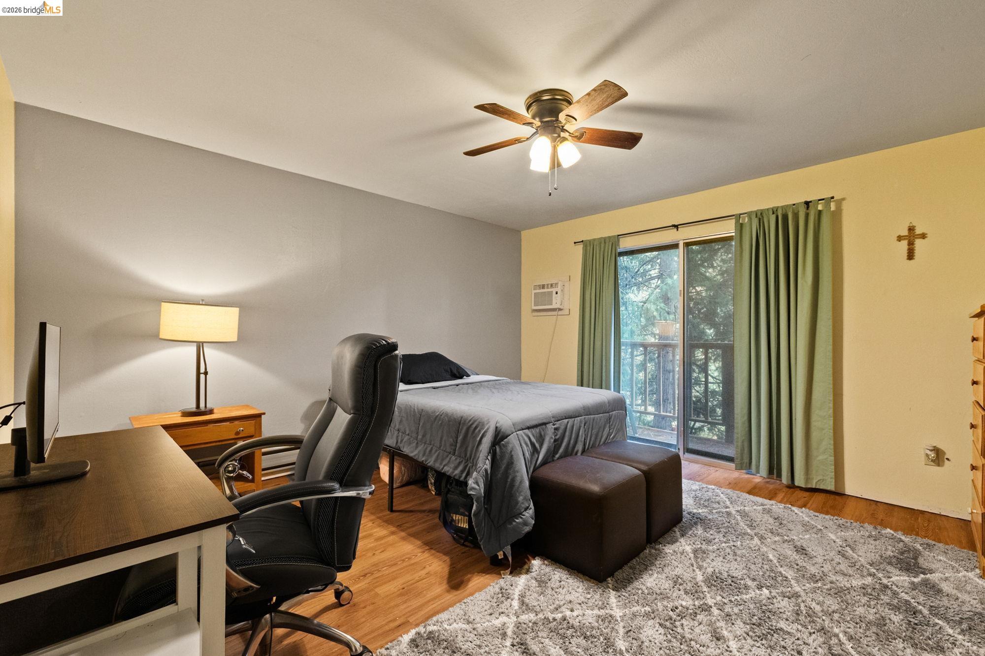 17851 Robin Road Twain Harte, CA 95383 - Photo 20 of 45 Bedroom featuring a desk, access to exterior, light wood-style flooring, and a ceiling fan