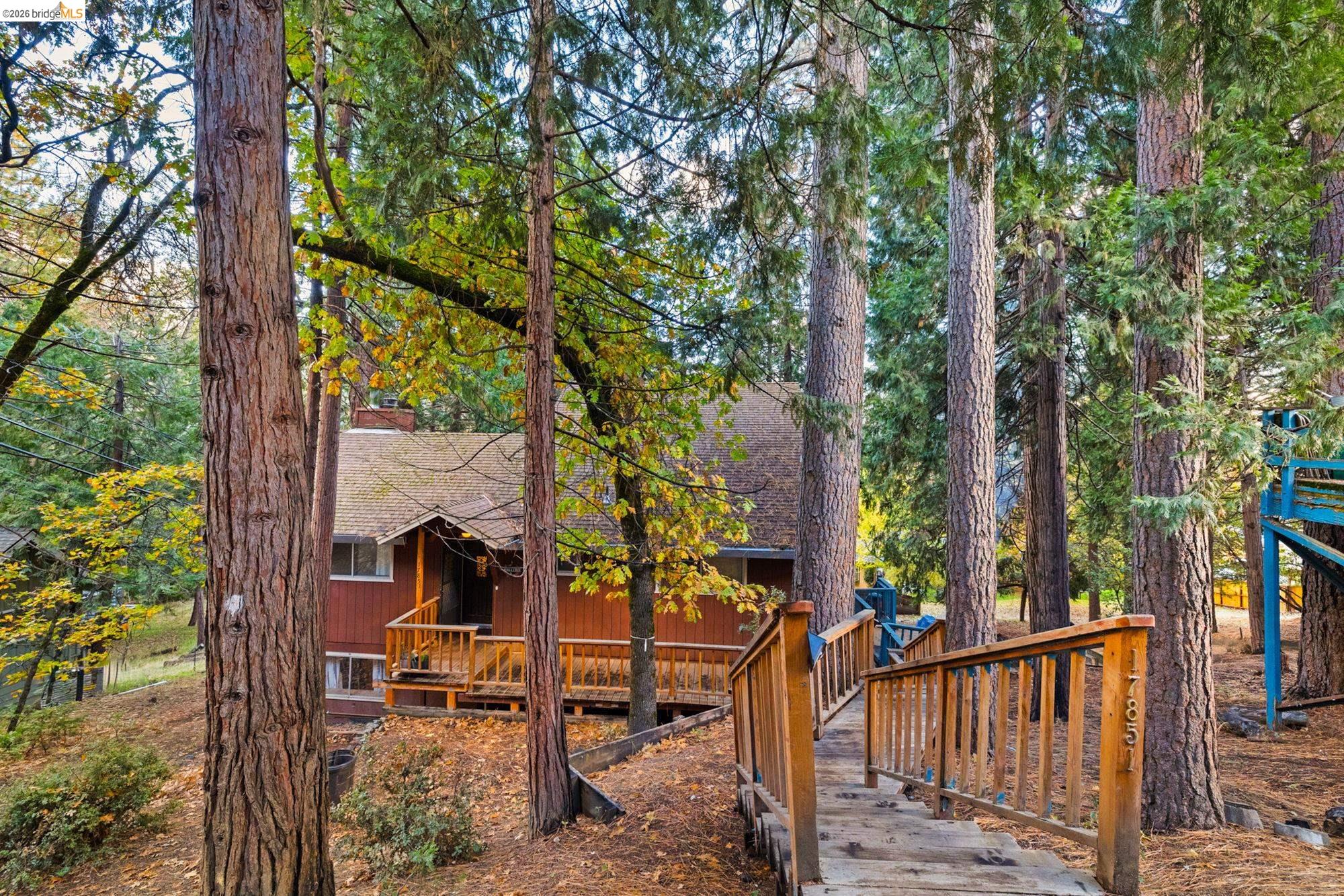 17851 Robin Road Twain Harte, CA 95383 - Photo 2 of 45 Back of property featuring a shingled roof and a wooden deck