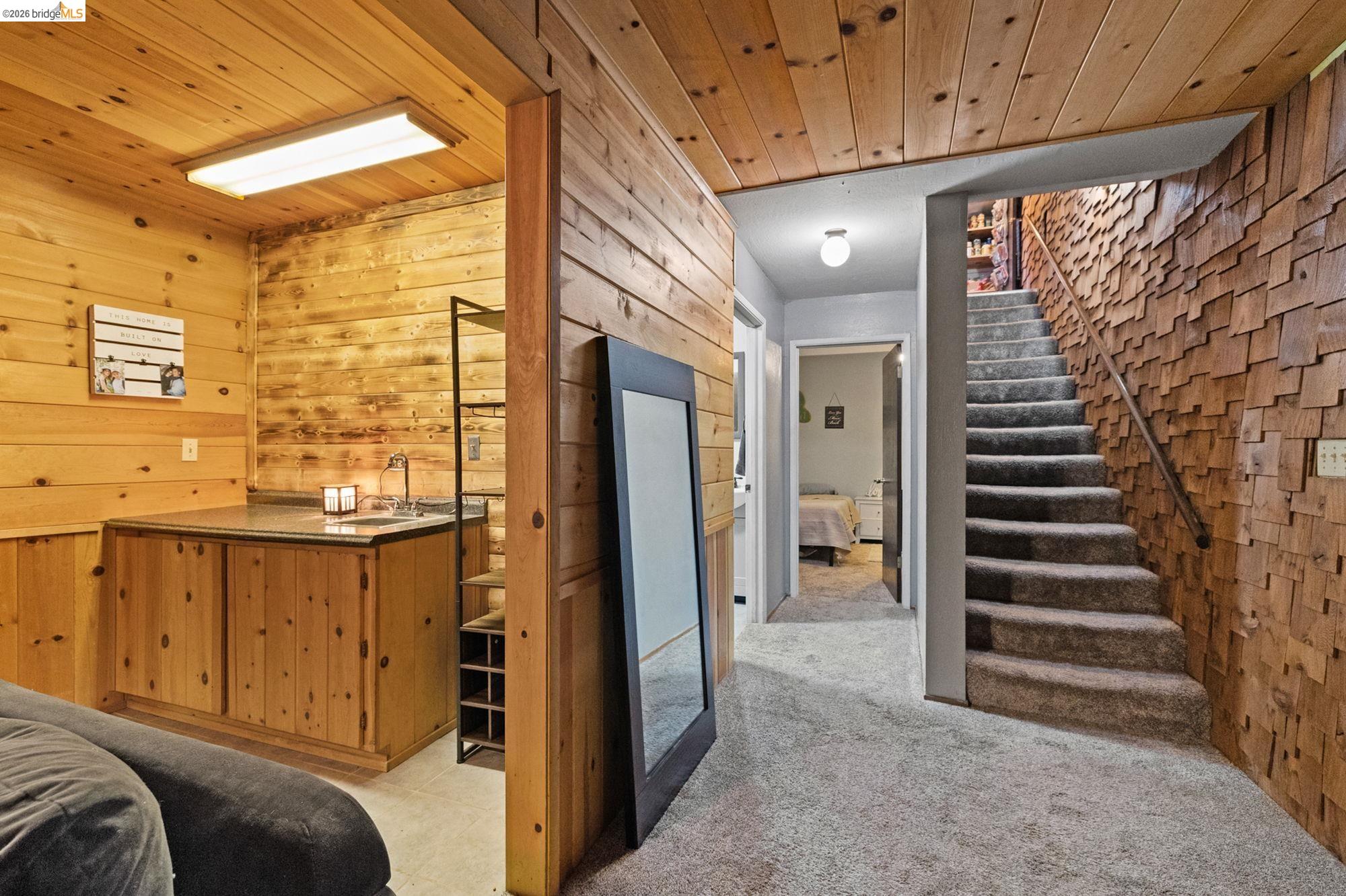 17851 Robin Road Twain Harte, CA 95383 - Photo 28 of 45 Bedroom featuring wood ceiling, wooden walls, and light carpet