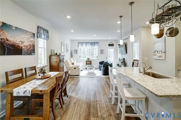 a kitchen with stainless steel appliances granite countertop a sink refrigerator and microwave