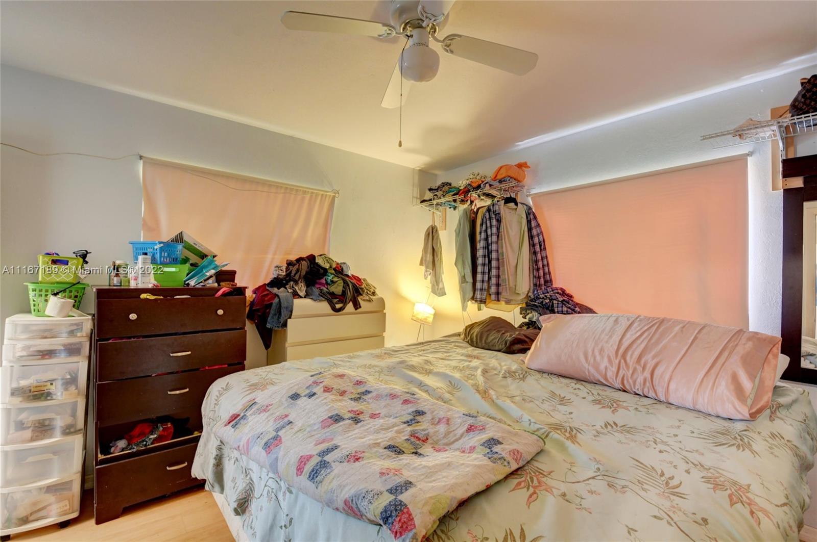 1945 North Conference Drive Boca Raton, FL 33486 - Photo 15 of 19 a bed room with a bed and a dresser