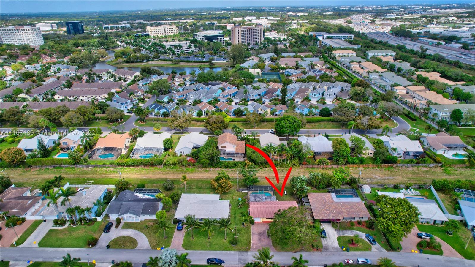 1945 North Conference Drive Boca Raton, FL 33486 - Photo 3 of 19 an aerial view of residential house with outdoor space and lake view