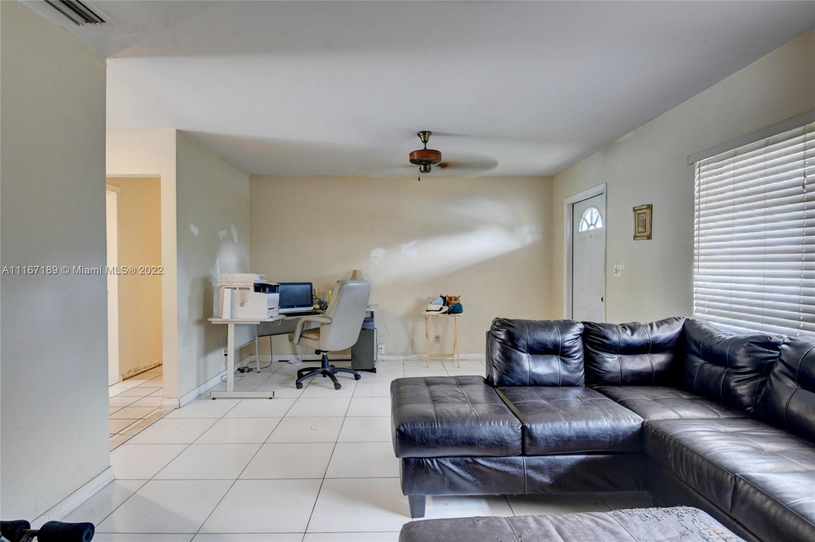 1945 North Conference Drive Boca Raton, FL 33486 - Photo 8 of 19 a living room with furniture
