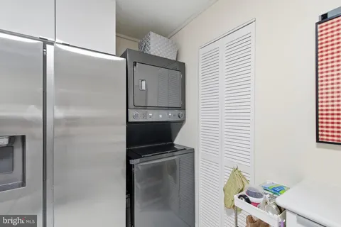 a kitchen with a refrigerator and a sink