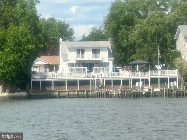 a front view of a house with a lake view