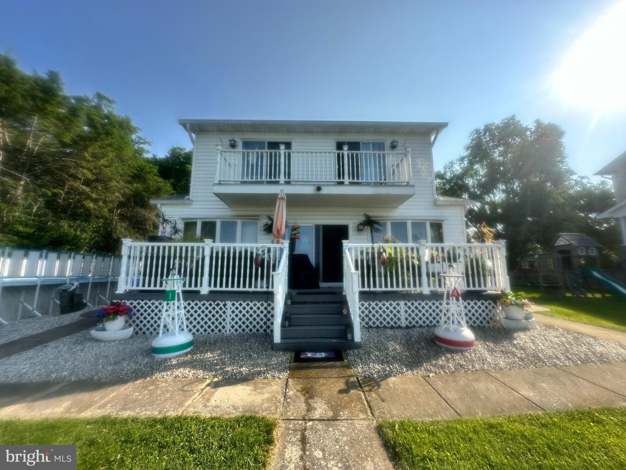1507 Shore Road Baltimore, MD 21220 - Photo 2 of 46 a front view of a house with a garden
