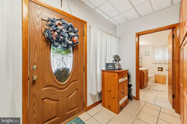 a view of a entryway door with wooden floor