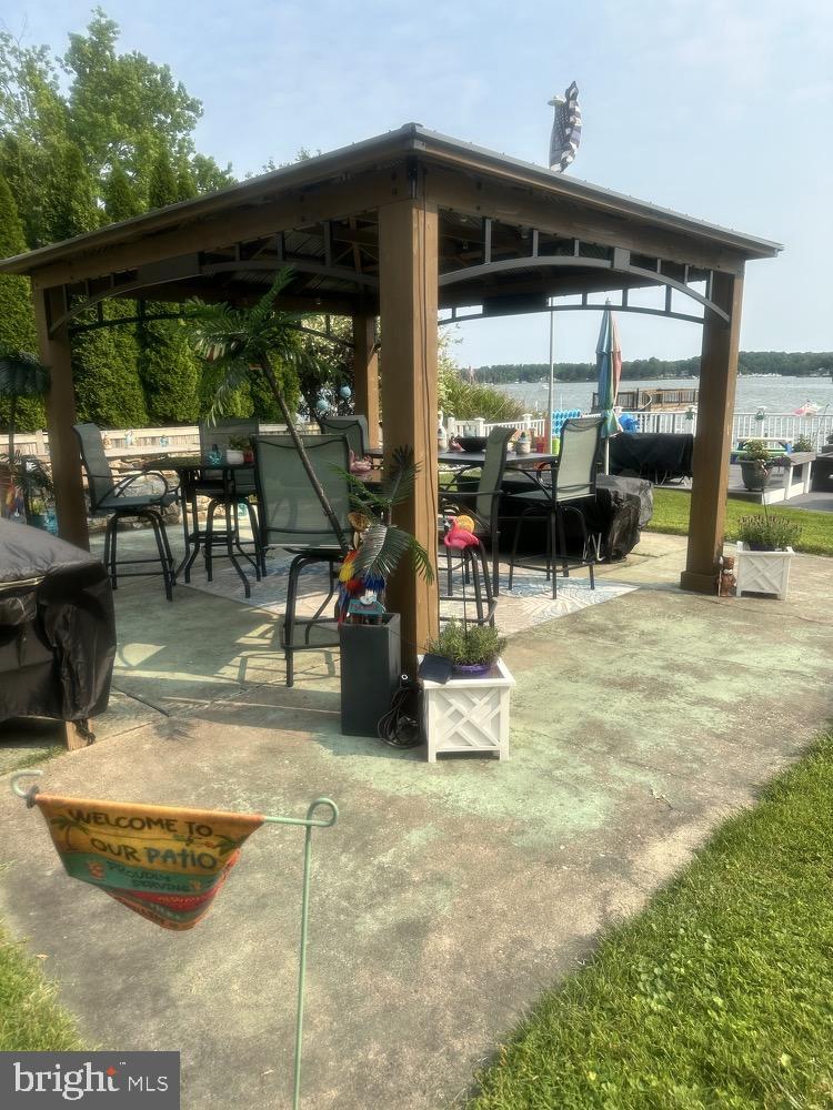 1507 Shore Road Baltimore, MD 21220 - Photo 3 of 46 a view of a porch with chairs and backyard
