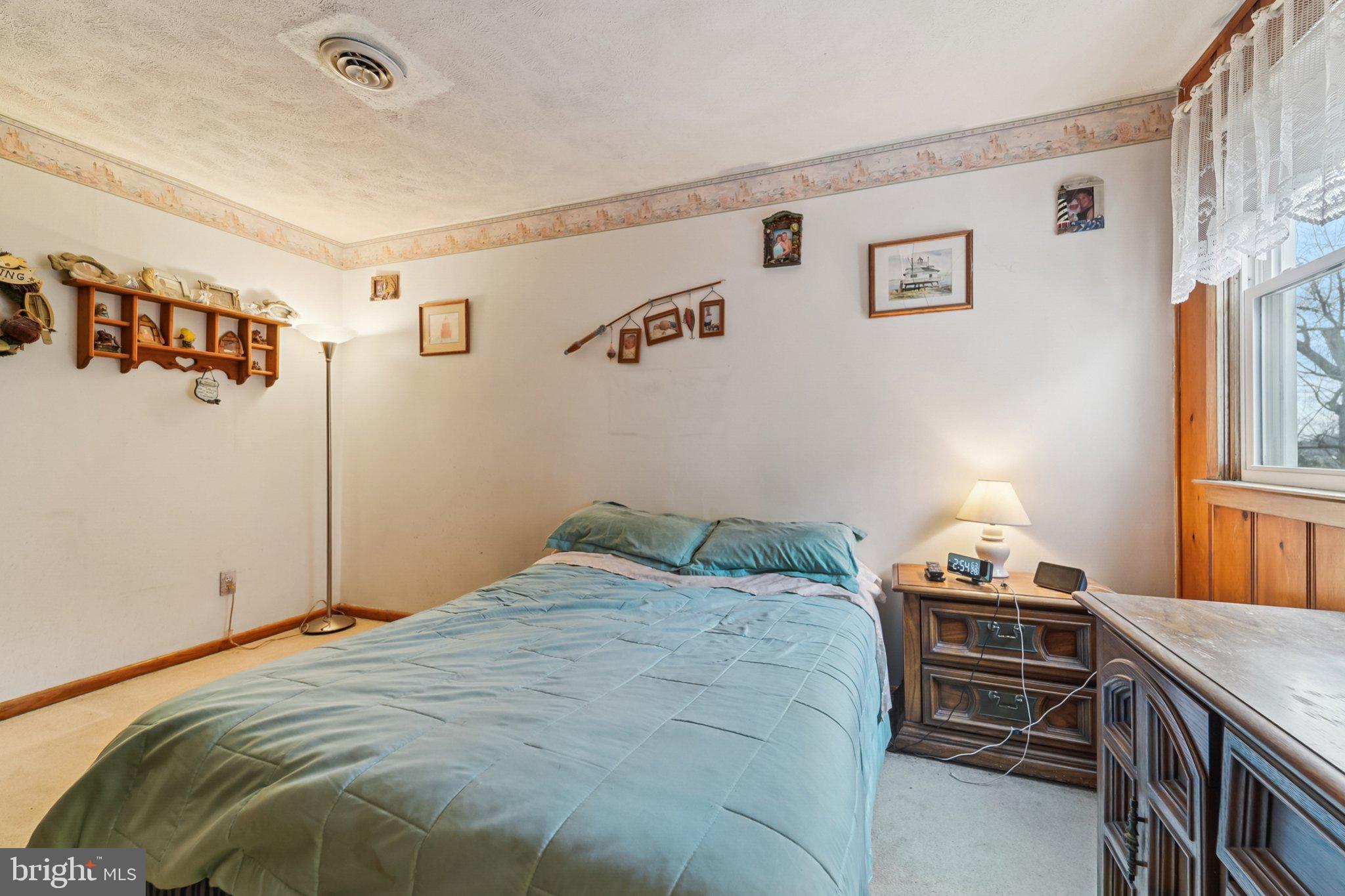 1507 Shore Road Baltimore, MD 21220 - Photo 37 of 46 a bedroom with a bed and a window