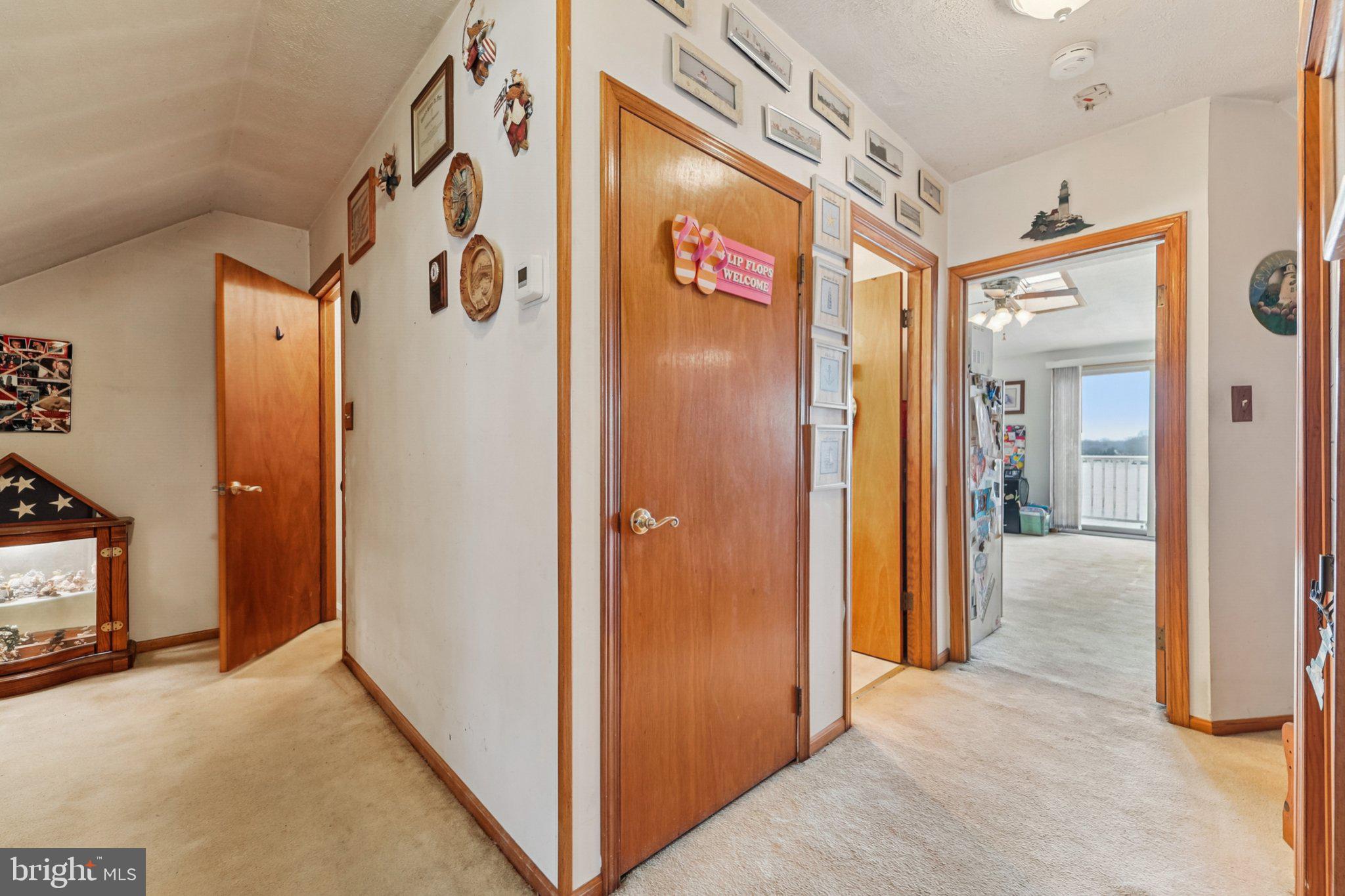 1507 Shore Road Baltimore, MD 21220 - Photo 38 of 46 a view of a hallway with wooden shelves
